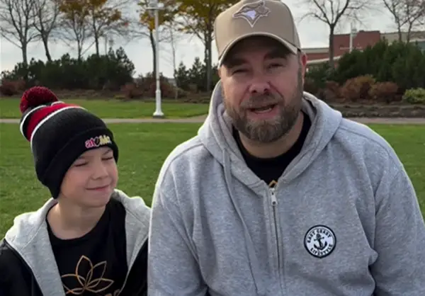 Emile Gaudet, right, and his son, John, are spreading kindness in Charlottetown by approaching random strangers and giving them gifts. Called Give Bliss Media, the encounters are recorded and have become a hit on social media platforms.